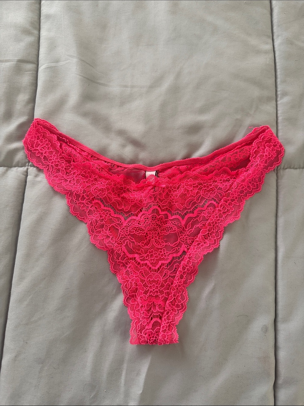 Victoria’s Secret size medium, hot, pink lace thong